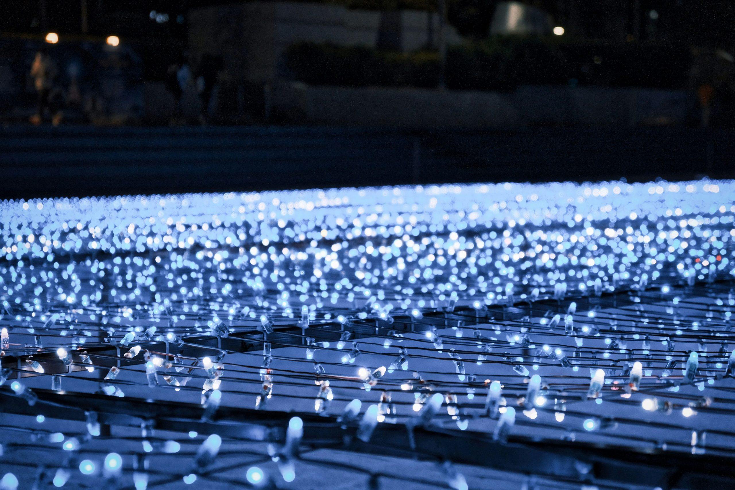 a row of rows of rows of blue lights